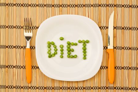 Peas on the plate forming the word dietの写真素材