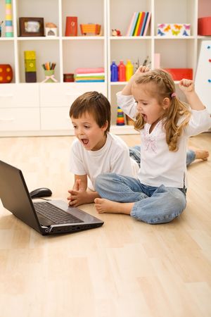 Stressed kids about to win online game - technology addict generationの写真素材