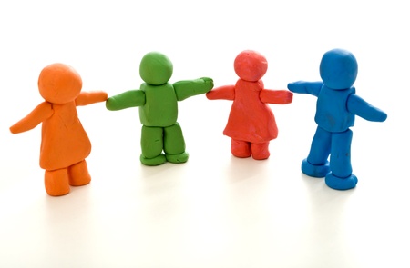 Colorful clay people on white - unity in diversity or family concept