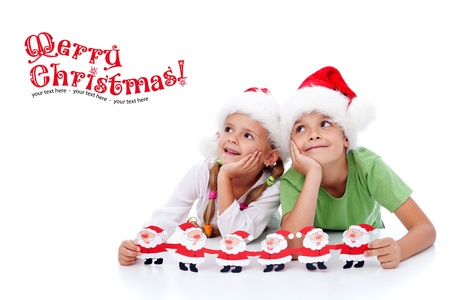 Happy christmas kids dreaming about santa - looking to copy spaceの写真素材