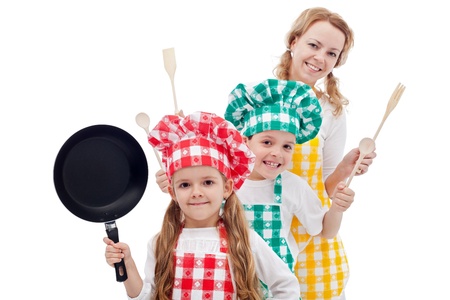 Happy chefs family standing in row holding cooking utensils - isolatedの写真素材