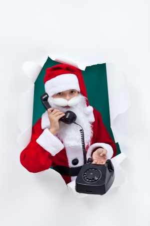 Give santa a call this christmas telling him your wishesの写真素材