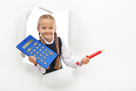 Young student holding calculator and large pencil - with copy space