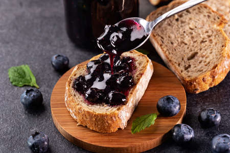 Blueberry jam with wholegrain bread - delicious breakfast optionの写真素材