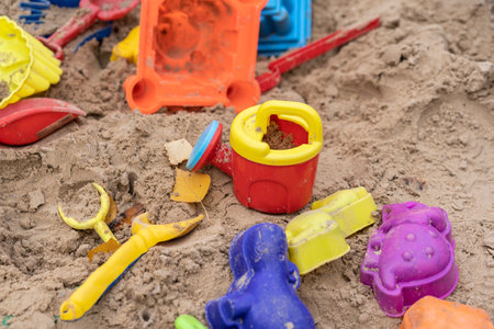 colorful sand toys in the sandの写真素材
