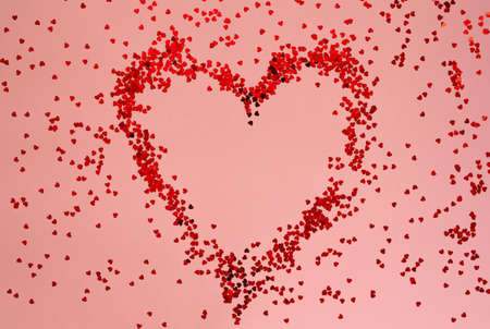 Red heart with sparkles on pink background. Valentines Day, International Womens Day