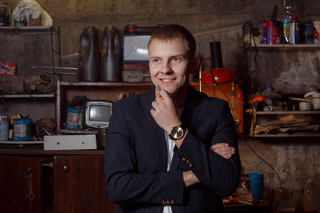 a man in a suit on an industrial premises!の写真素材
