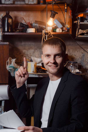 a man in a suit on an industrial premises!の写真素材