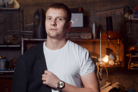 a man in a suit on an industrial premises!の写真素材