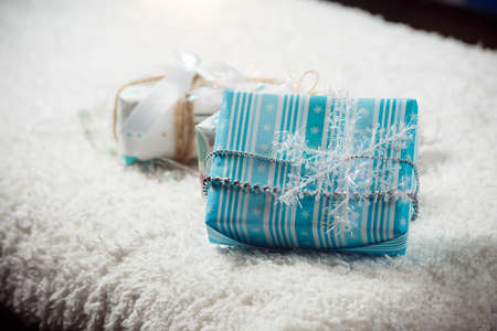 Various Christmas presents in home white blueの写真素材