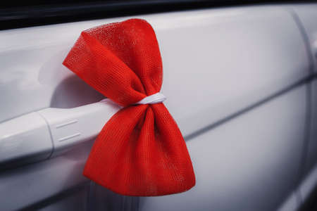 Wedding decoration on wedding car, beautiful red bowの写真素材