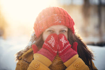 Portrait of romantic girl at sunset, sunrise, gold per hour on a frosty winter day,eveningの写真素材