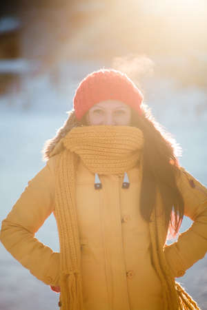 Portrait of romantic girl at sunset, sunrise, gold per hour on a frosty winter day,eveningの写真素材