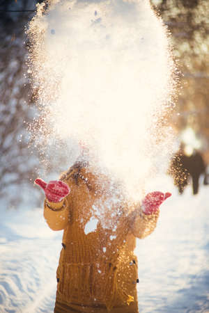 Portrait of romantic girl at sunset, sunrise, gold per hour on a frosty winter day,evening