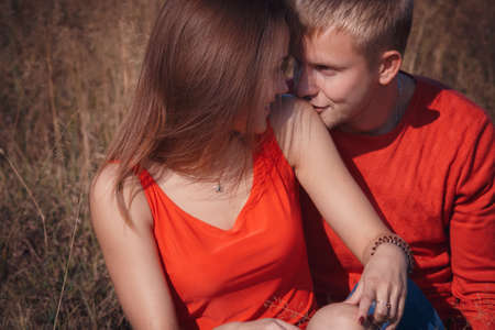 the loving couple walks on the wheat field, love storyの写真素材
