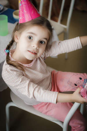 portrait of a little girl in pink blouse homes