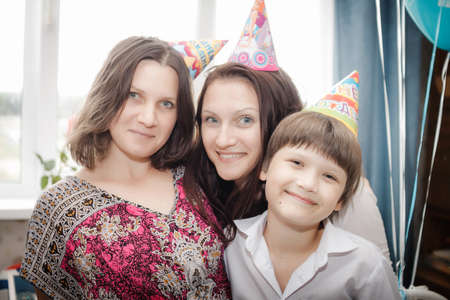 family portrait of mother and her children at homeの写真素材