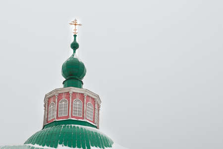 Dome of the thrown church against the background of the gray sky. A symbol of the left beliefの写真素材