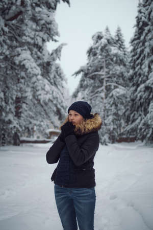 walks outdoors: the girl walks on the winter forestの写真素材