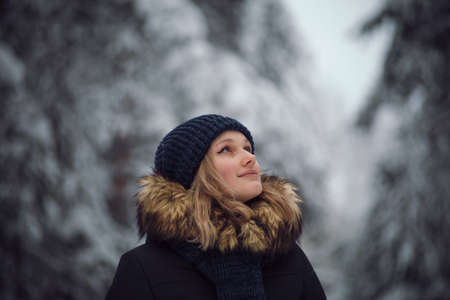 walks outdoors: the girl walks on the winter forestの写真素材