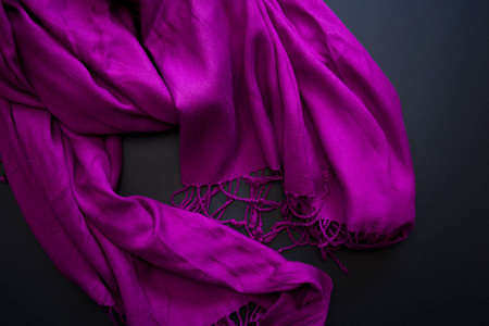 Violet scarf on black backgroundの写真素材