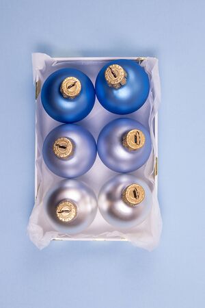 Matte blue balls into a box. Christmas and New Year concept.の写真素材
