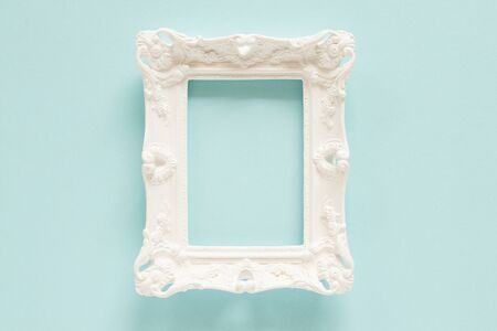 White empty decorative frame on the blue background.の写真素材