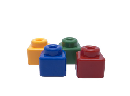 Four color blocks (yellow, blue, green, red), isolated.