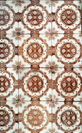Mosaic tiles, Portugal Azulejo Classic and Traditional. Brown Patterned wall, medieval ceramics tile, heritage. Painted panel with a round geometric pattern. Mauritanian Wallpeper from Lisbon cityの写真素材