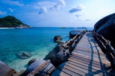 Wood bridge on the sea of Thailandの写真素材