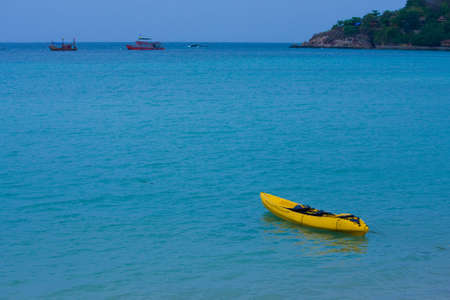 Yellow boat in sea of Thailandの写真素材