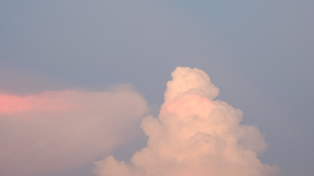 Pink clouds on the blue sky.の写真素材