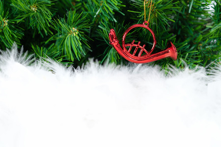 christmas decorated ornament hanging in green fir tree. Open space for write, AF point selection.