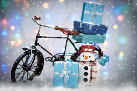 Snowman Cycling in the snow on bokeh background, AF point selection and make snowflake.の写真素材