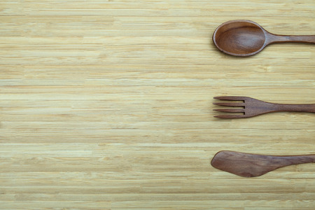 Kitchen utensils at  right of wooden background top view with space for write.の写真素材