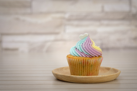 Cupcakes are beautifully decorated in clear lighting, AF point selection.の写真素材