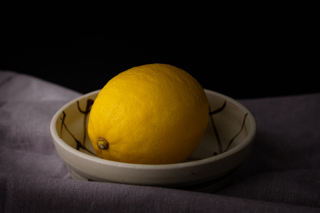 Still life with lemons on black background, Choose focal point, dark light style.の写真素材