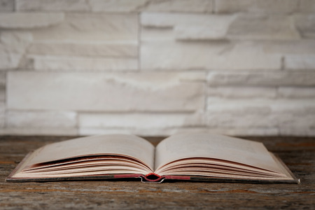 Open book on the wooden tablfe.の写真素材