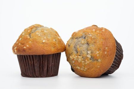 Two blueberries muffin on white background.の写真素材