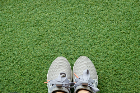 The women's sneaker, which stands on a green lawn.の写真素材