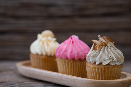 Tasty cupcakes on a vintage background, sweet dessert for christmas, new year and valentine holliday.の写真素材