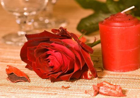 scarlet sweetheart rose and candleの写真素材