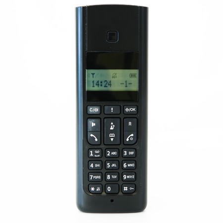 black telephone receiver with cord on white の写真素材