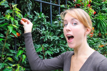 Outdoor portrait young woman with green garden