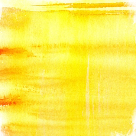 yellow watercolor paints on a rough texture paper
の写真素材