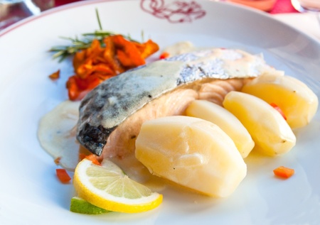 delicious plate of fish and potatoesの写真素材