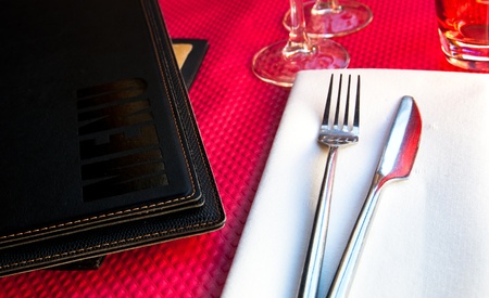 place setting - plate, knife and fork on tableの写真素材