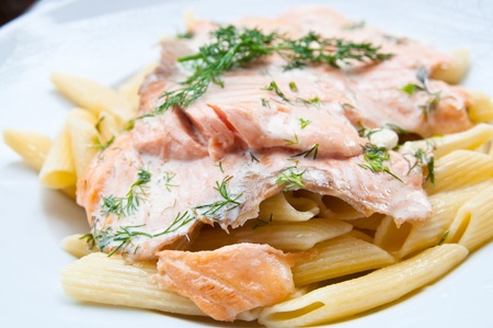 close-up of plate of pasta and smoked salmonの写真素材
