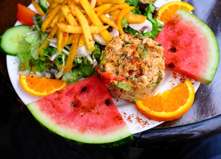 Fresh fruits salad - Delicious fresh salad with tomatoesの写真素材