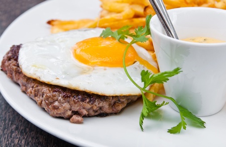 Egg and fries - classical english breakfast with egg and friesの写真素材